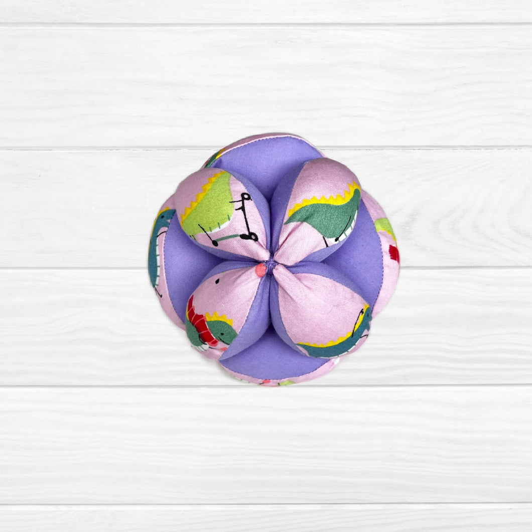 Pelota montessori dinosaurios/ rosado